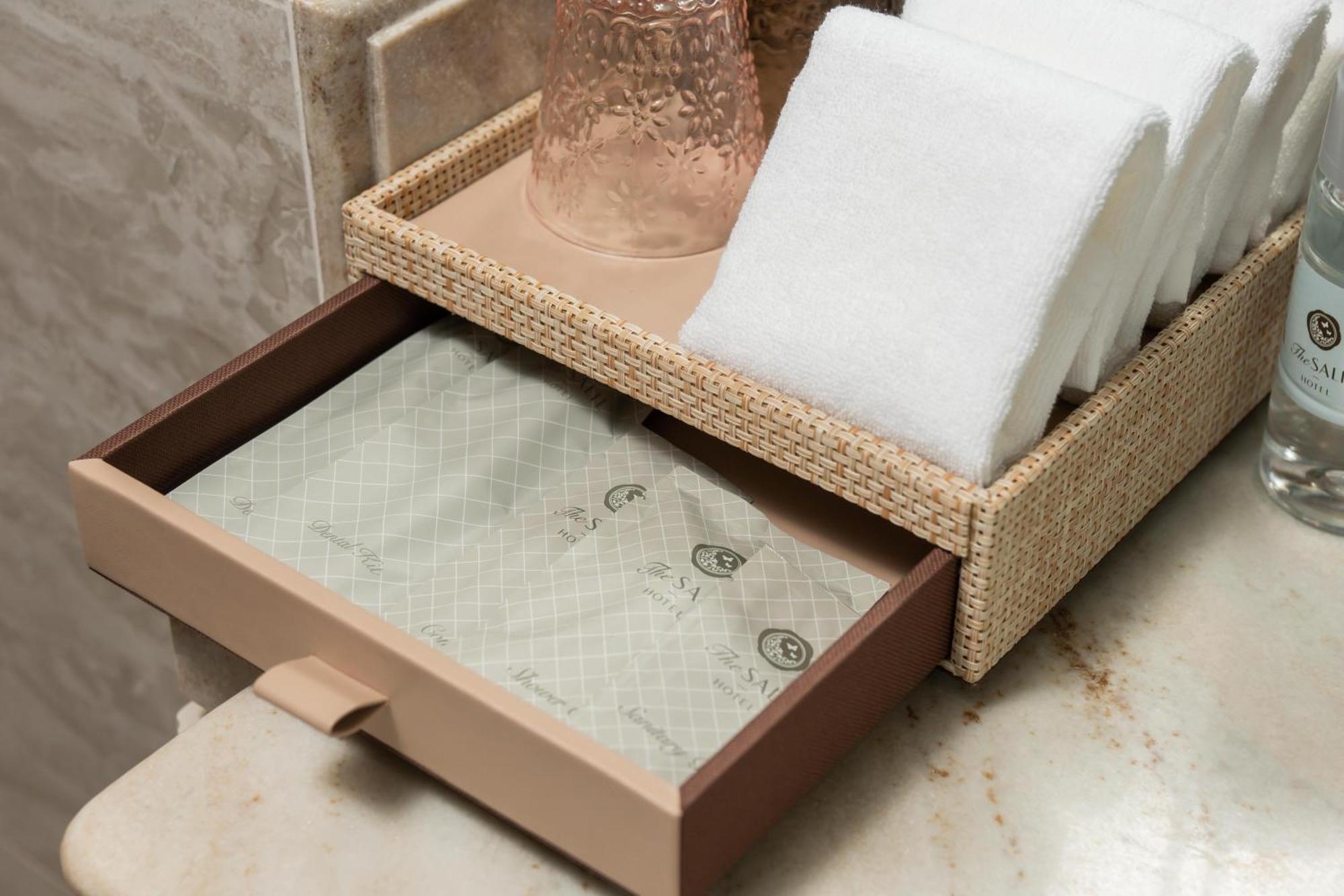 The Salil Hotel Riverside Bangkok Bagian luar foto A drawer with a guest directory